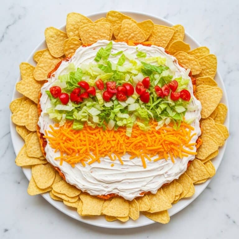 Creamy Taco Dip with Cheddar, Tomato, and Lettuce Recipe